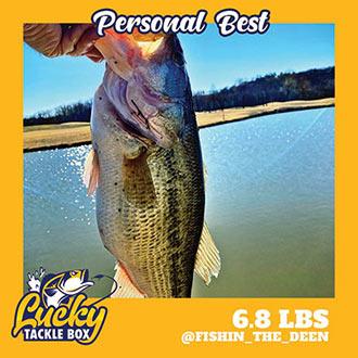 6.8 lbs bass fish with the background of Lucky Tackle Box Logo