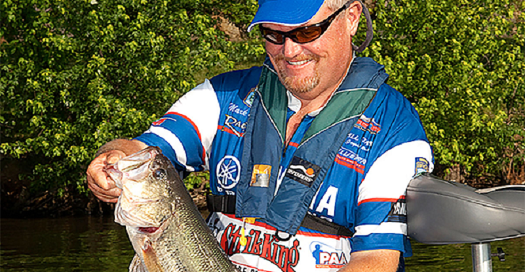 https://www.luckytacklebox.com/wp-content/uploads/2022/03/man-with-a-blue-hat-holding-fish-smiling.png