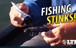 Fishing stinks man spraying scent on the bait