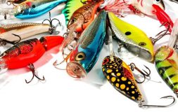 Multiple fishing baits with hooks on the white background