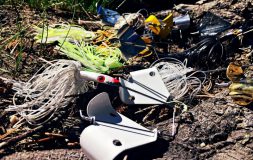 Several multicolor buzzbaits placed on the ground